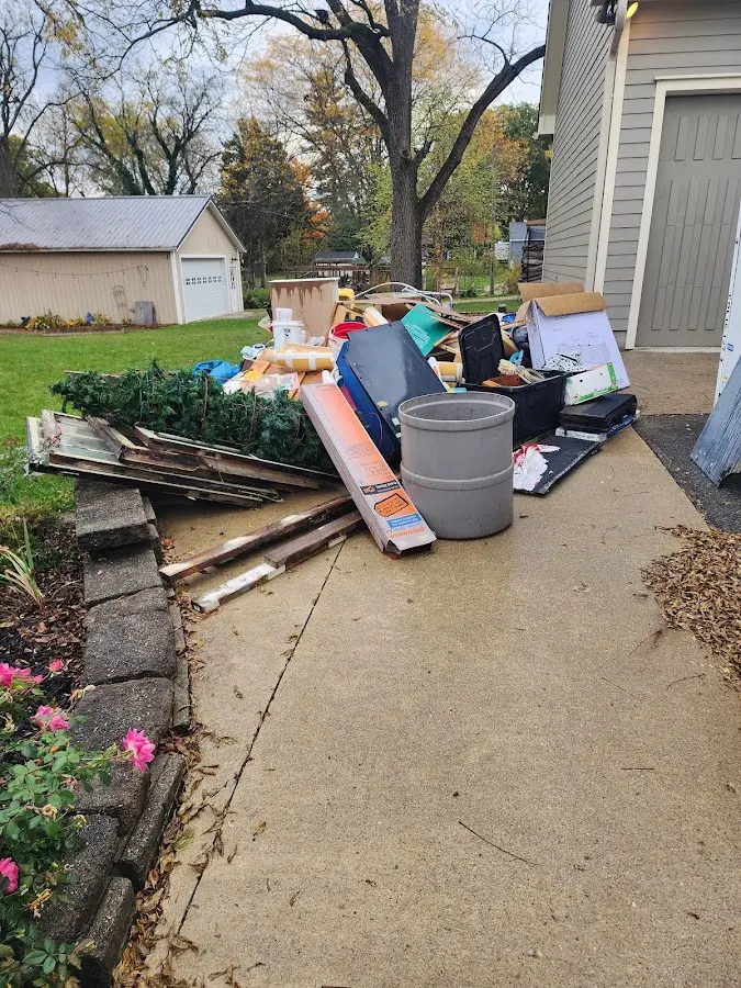 Dumpster being loaded with debris for Roofing Dumpster Rental in Hailey